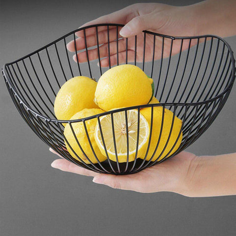 Black wire fruit basket holding lemons