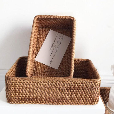 Three rattan storage boxes used as drawer dividers