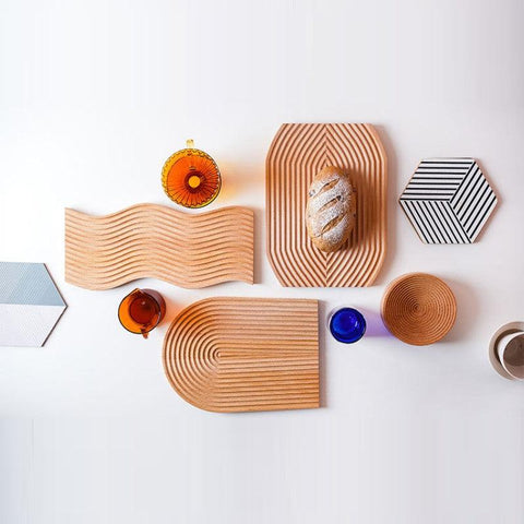 Wooden ripple and arch trays styled with small objects