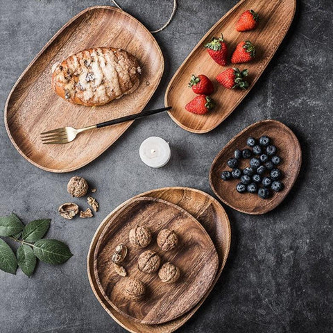 Wooden serving plates holding nuts and fruit